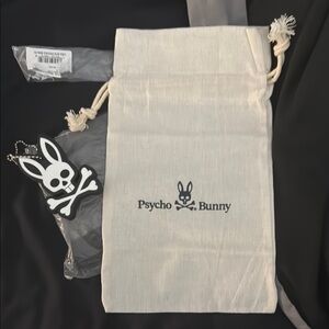 Psycho Bunny White Drawstring Bag with Black Logo and floating black keychain